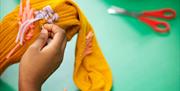 Socks: The Art of Care and Repair, by London based textile artist Celia Pym