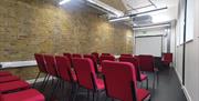 Studio 1, original features, can accommodate up to 30 people.