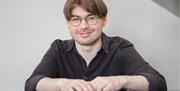 Hear musician, Tomos Boyles' talents on the piano