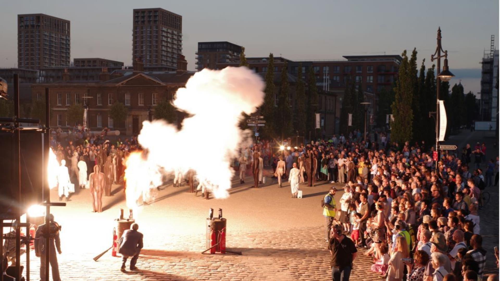 An event with large crowds, smoke and fire in Royal Arsenal Woolwich.