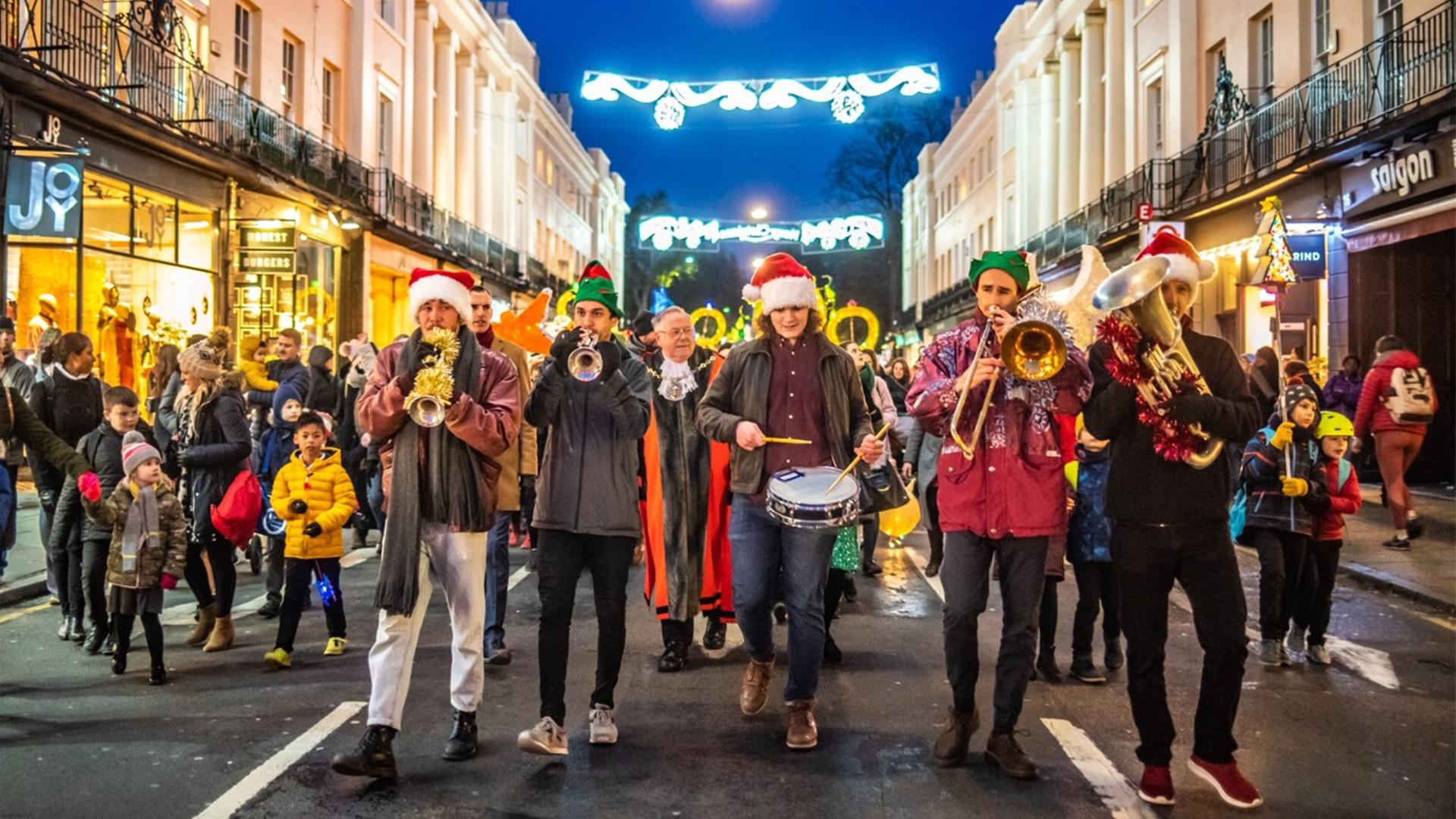 A group of trumpeters lead the lantern parade through Greenwich at Christmas