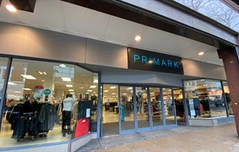 A photo taken outside of Primark, showing a fashion paradise filled with a huge variety of items.