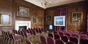 Purple chairs in theatre layout at the Admiral's House, Old Royal Naval College