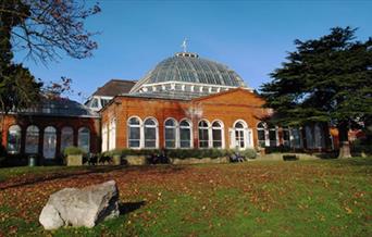 View of the Avery Hill Park - Winter Garden in autumn, a botanic garden with a beautiful opulent glass domed roof.