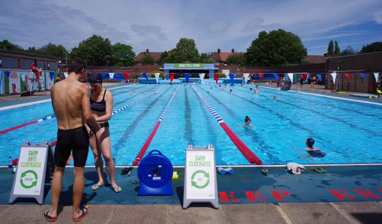 Two people prepare to get into the water at Charlton Lido in Charlton, Greenwich.