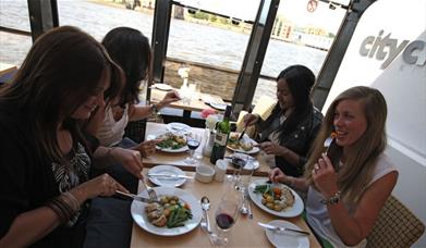 Four ladies enjoying their lunch onboard City Cruises Lunch Cruise.