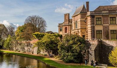 Eltham Palace surrounded by the beautiful gardens and moat.