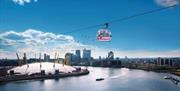 Emirates Air Line carrier on above river Thames, overlooking The O2 on a bright sunny day