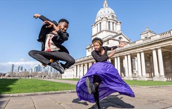 Two artists performing in front of Old Royal Naval College.