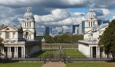 Beautiful Old Royal Naval College and its grounds with Canary Wharf skyline in the background.
