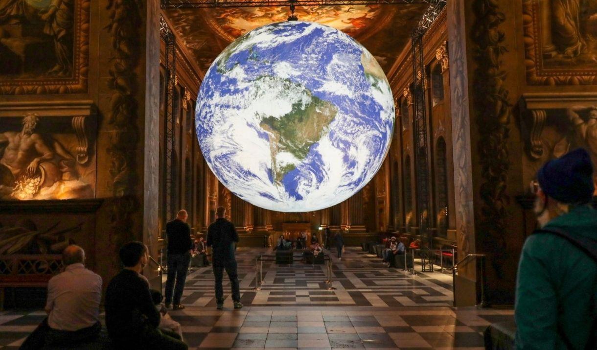 Luke Jerram’s awe-inspiring art installation Gaia which is an internally-lit globe sculpture is displayed in the centre of the Painted Hall.