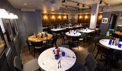 PizzaExpress dining with round table and dim lights