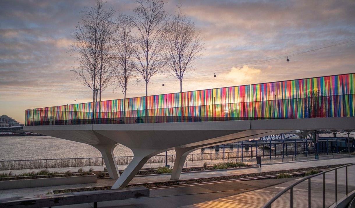 A colourful artwork wrapped on 700 m of walkway's glass balustrades, creating a ribbon of undulating colour.
