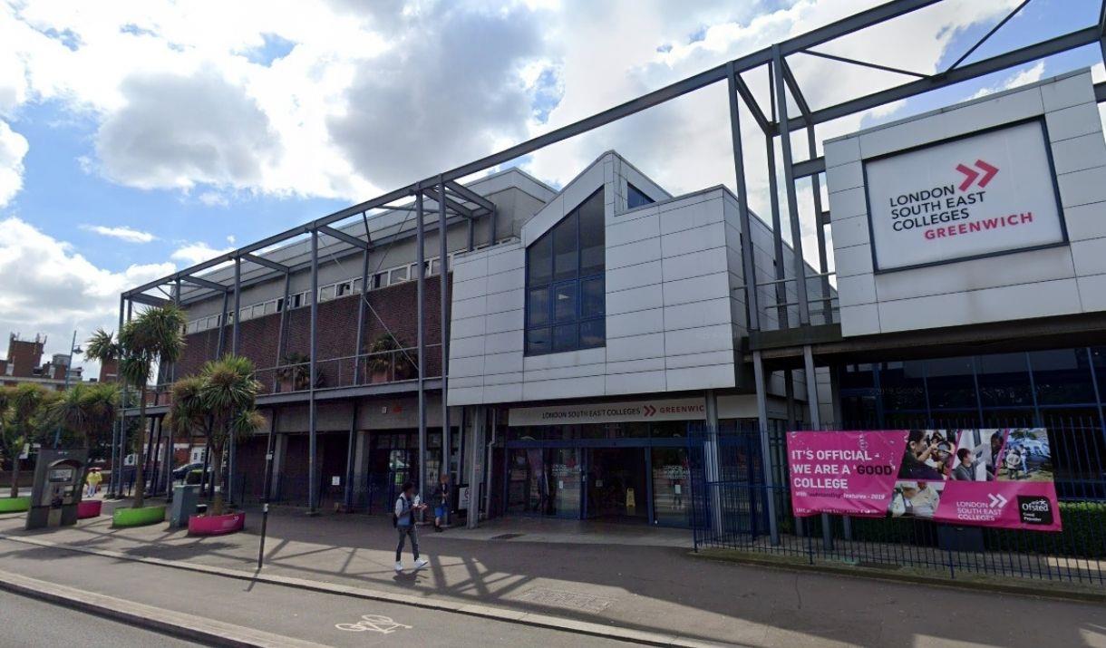 Outside view of London South East Colleges Greenwich campus with pink banner outside on the right side railing.