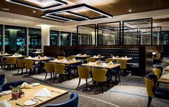 The luxurious interiors of the Market Brasserie at InterContinental London - The O2, overlooking Canary Wharf.