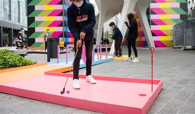 Swing into a summer of play with this family-friendly, fun-filled mini golf course designed by artist Yinka Ilori