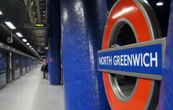 London Underground Sign in the foreground at North Greenwich Underground Station