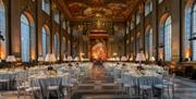 white banqueting round tables setup in the Painted Hall for formal dinner