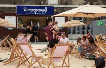 Rumpypumpy, the pop-up beach bar at Woolwich Works is back for summer 2023!
