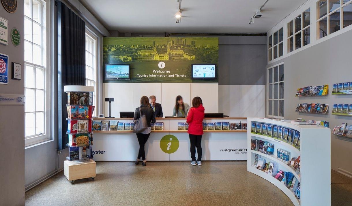 Customers being served at Greenwich Tourist Information Centre Desk