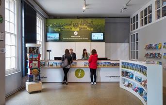 Customers being served at Greenwich Tourist Information Centre Desk