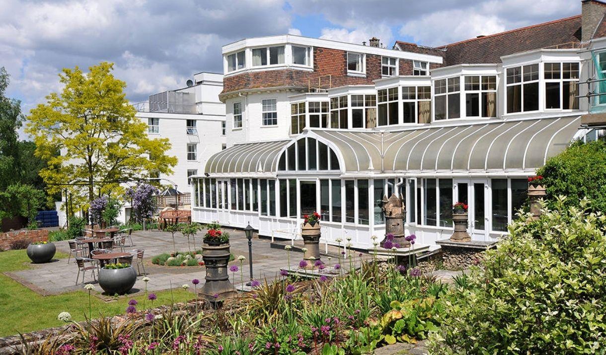 Image shows the grounds and entrance of The Bromley Court Hotel.