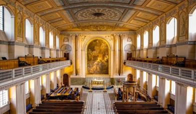 The beautiful neoclassical interior of the Chapel of St Peter and St Paul at the Old Royal Naval College in Greenwich.