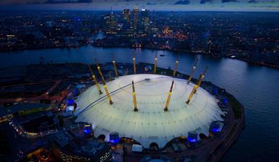The O2 from above next to the River Thames overlooking Canary Wharf
