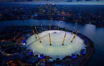 The O2 from above next to the River Thames overlooking Canary Wharf