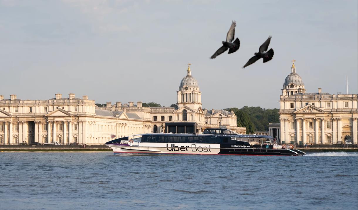 Pigeons and Uber Boat by Thames Clippers in front of Old Royal Naval College, Greenwich