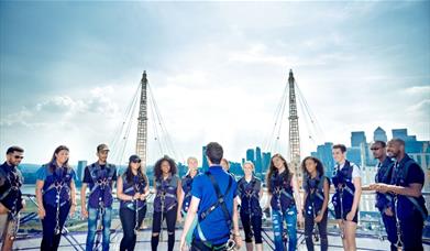 Group of people stood on the roof of The O2 at Up at The O2 overlooking Canary Wharf