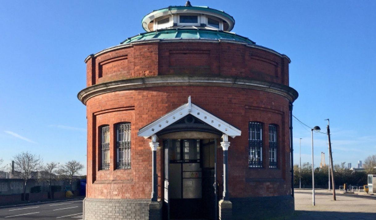 A guard house looking, red brick Woolwich Foot Tunnel entrance.