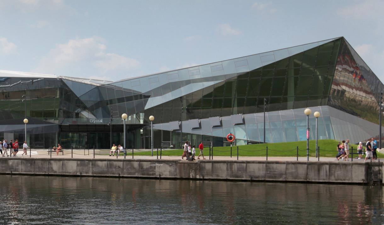 An outside picture of The Crystal, a nicely designed building located next to the royal Docks.